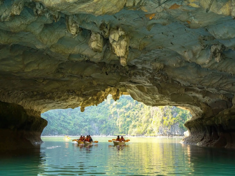Kayaking inside Hang Sang Toi Dark and Bright Cave Lagoon
