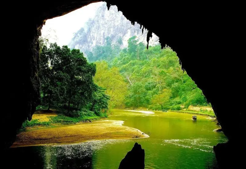 Subterranean river and stalactites inside Puong Cave